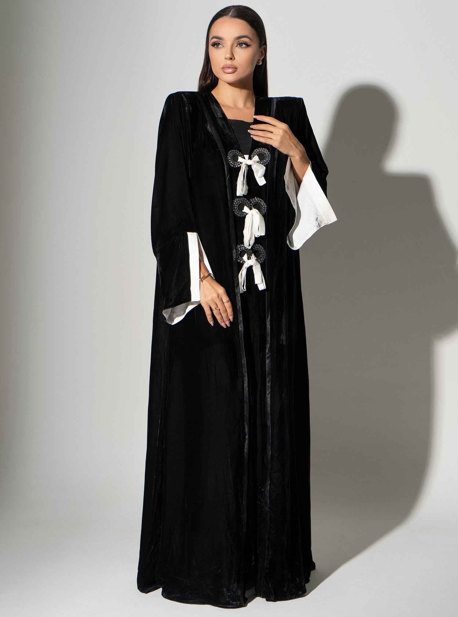 Piano-ABY023 – Elegant Black Velvet Abaya with Statement Bow Accents