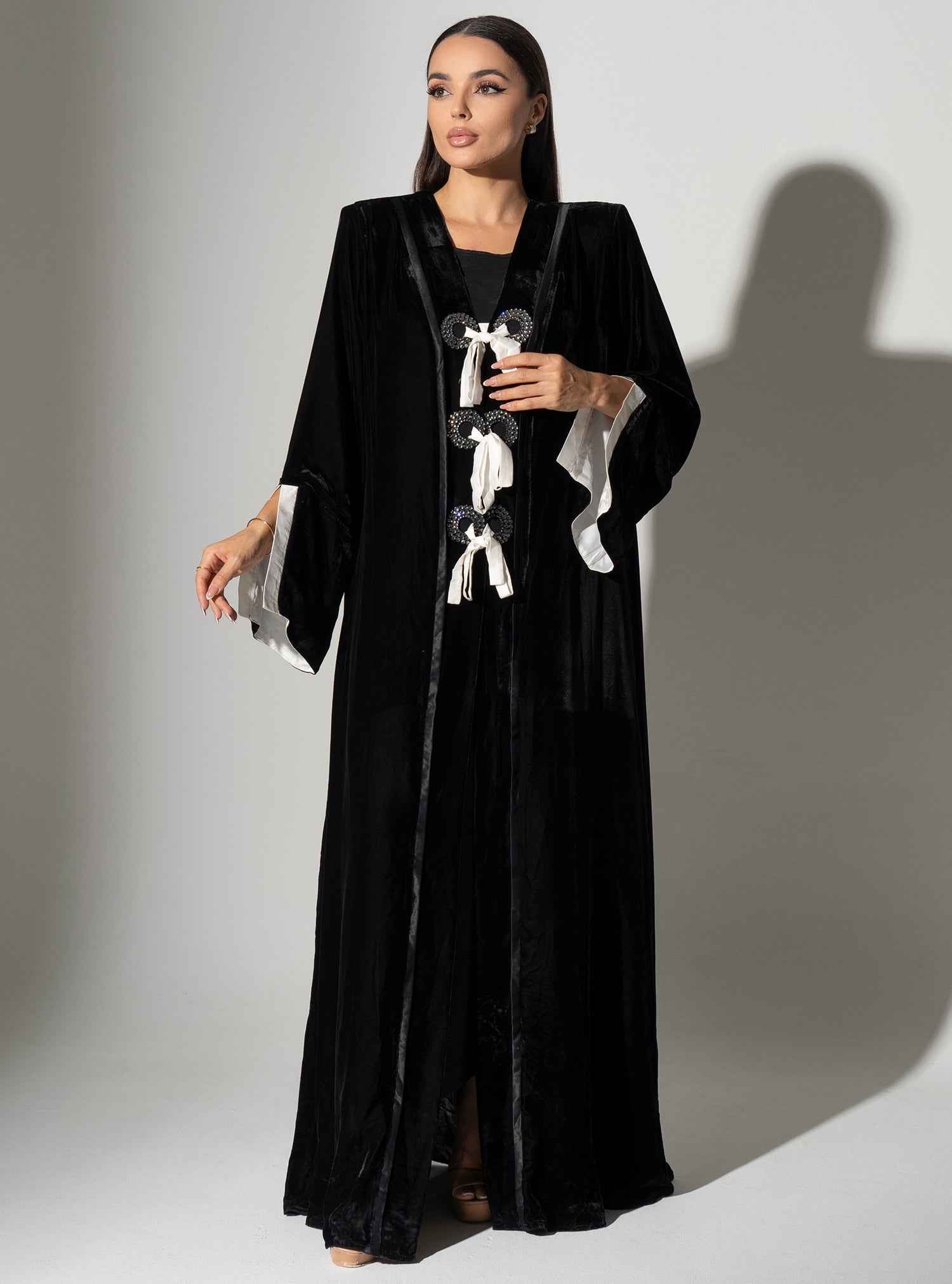 Piano-ABY023 – Elegant Black Velvet Abaya with Statement Bow Accents