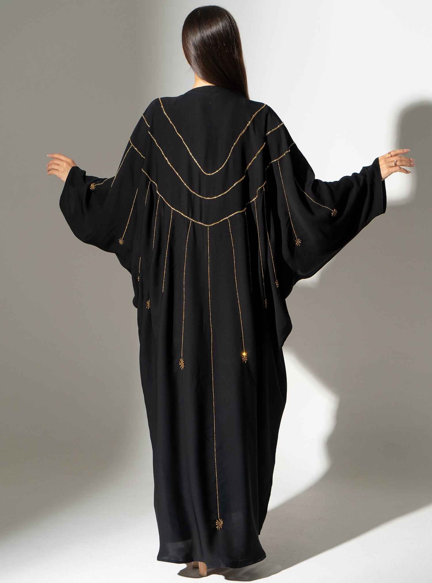 Cinder-ABY022 – Black Japanese Crepe Abaya with Exquisite Gold Bead Cascades