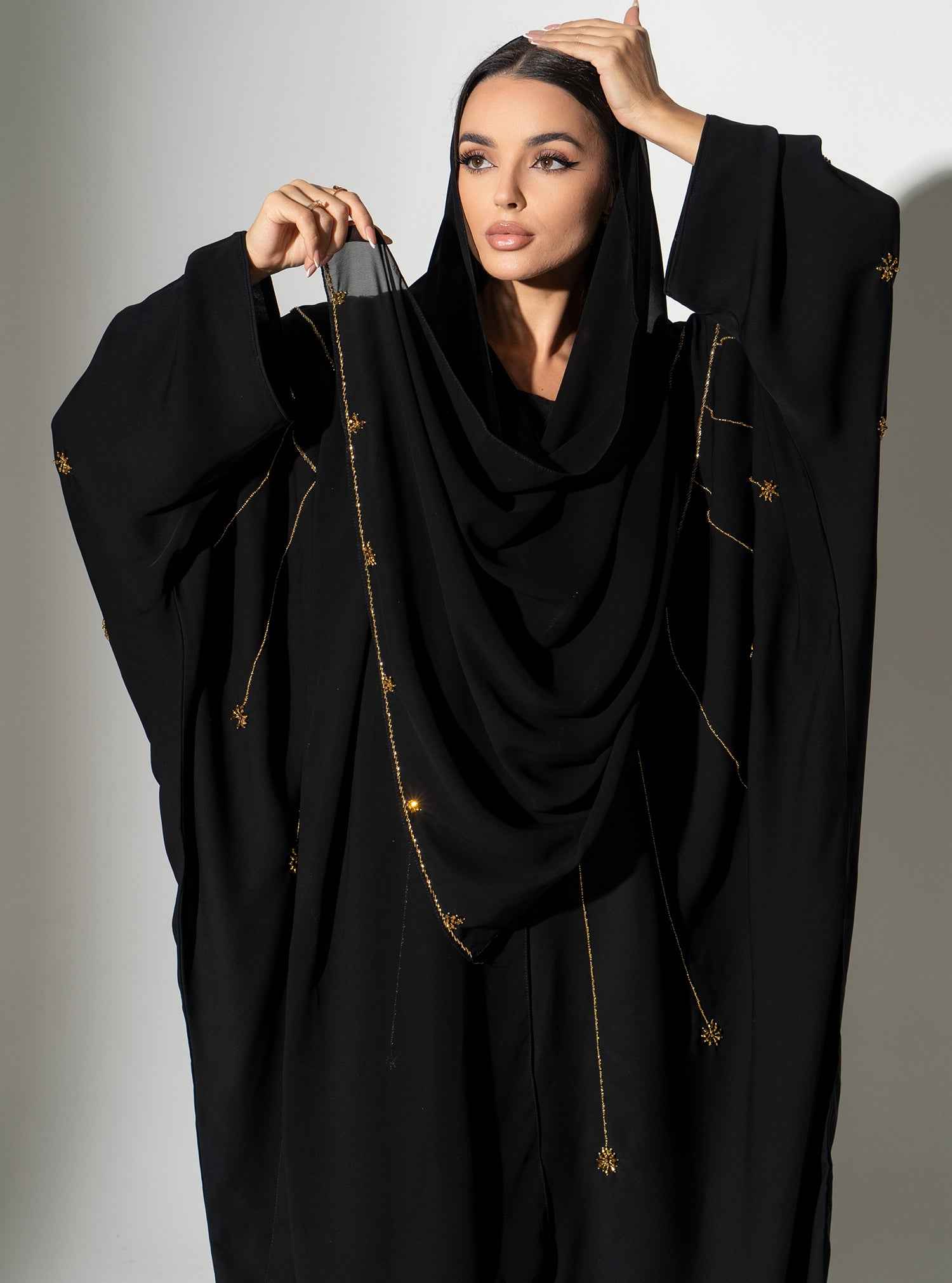 Cinder-ABY022 – Black Japanese Crepe Abaya with Exquisite Gold Bead Cascades