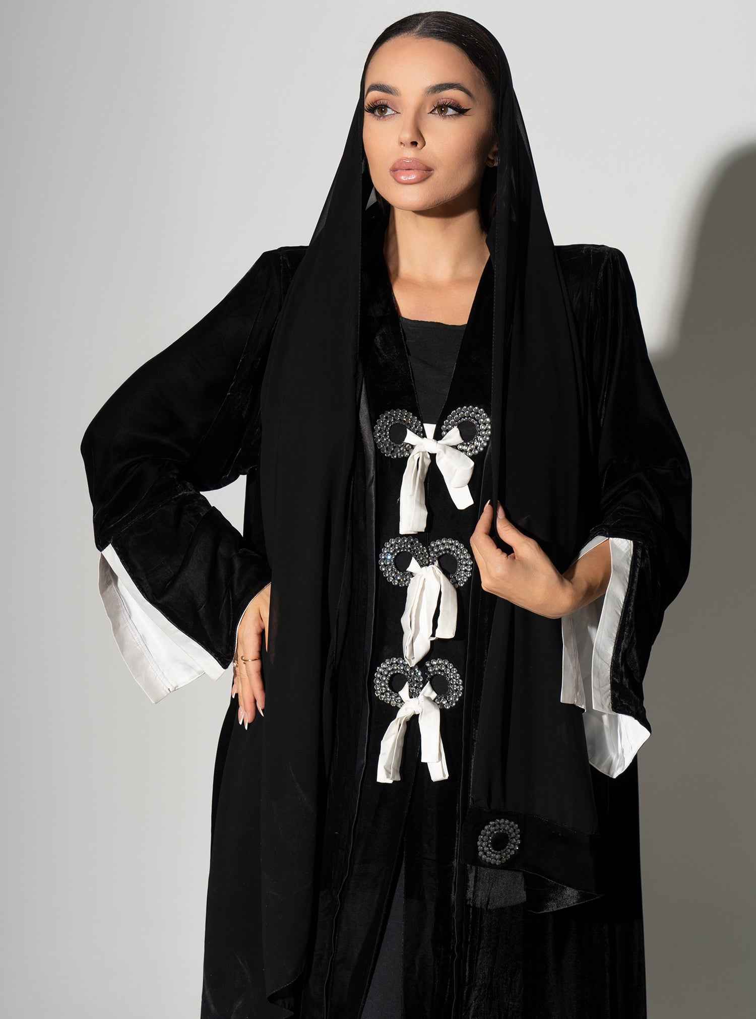 Piano-ABY023 – Elegant Black Velvet Abaya with Statement Bow Accents